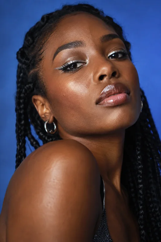 Illustrative beauty creator showing a metallic eye makeup look.